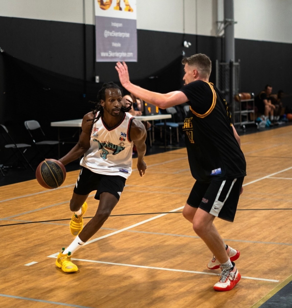 ROHO Warriors player driving past a defender at Legacy Athletics