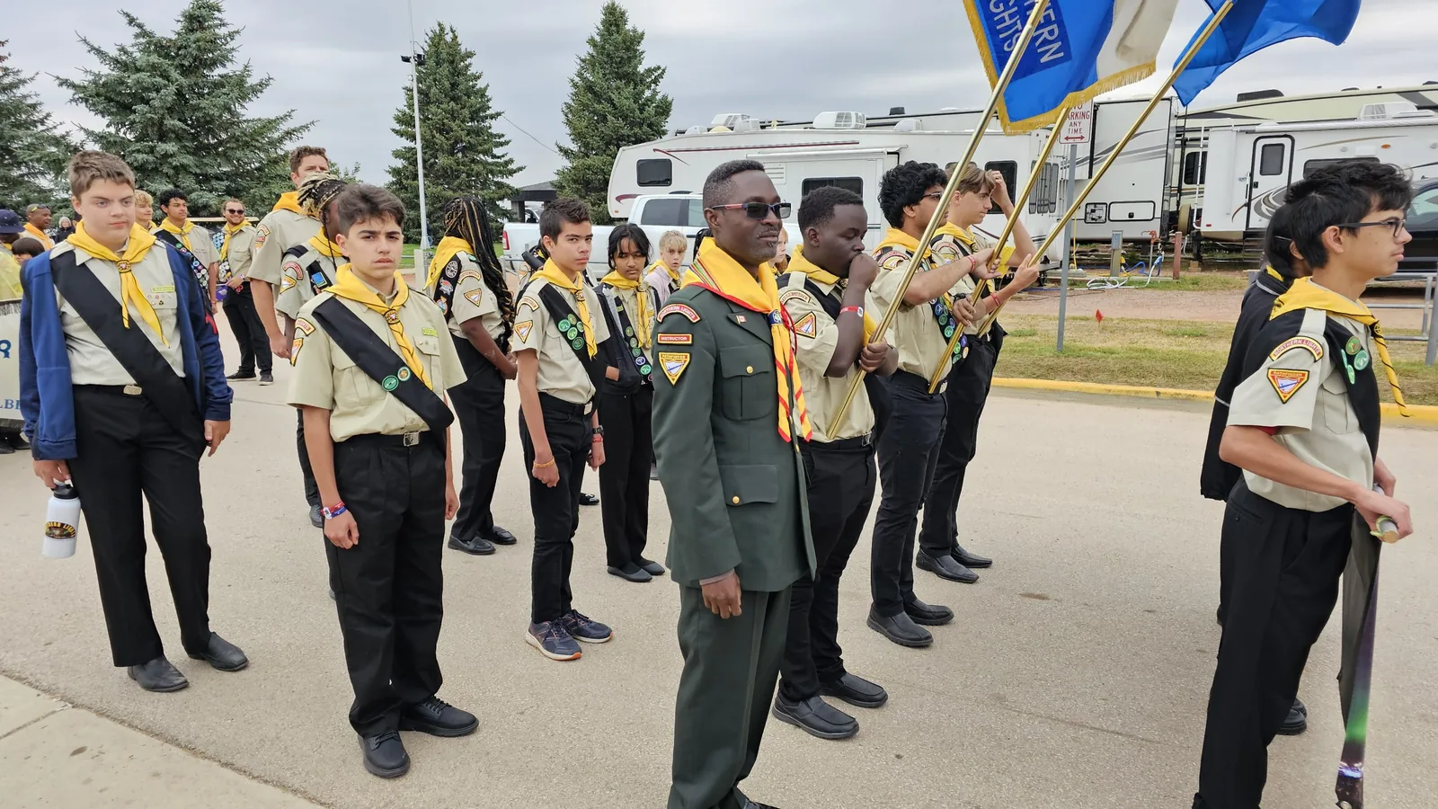Pathfinders in uniform standing in drill formation at a Northern Lights club event