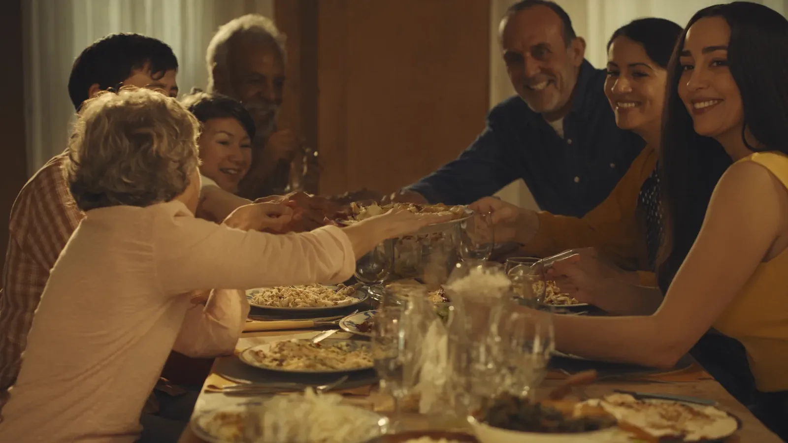 Families sharing a meal together at a church family weekend