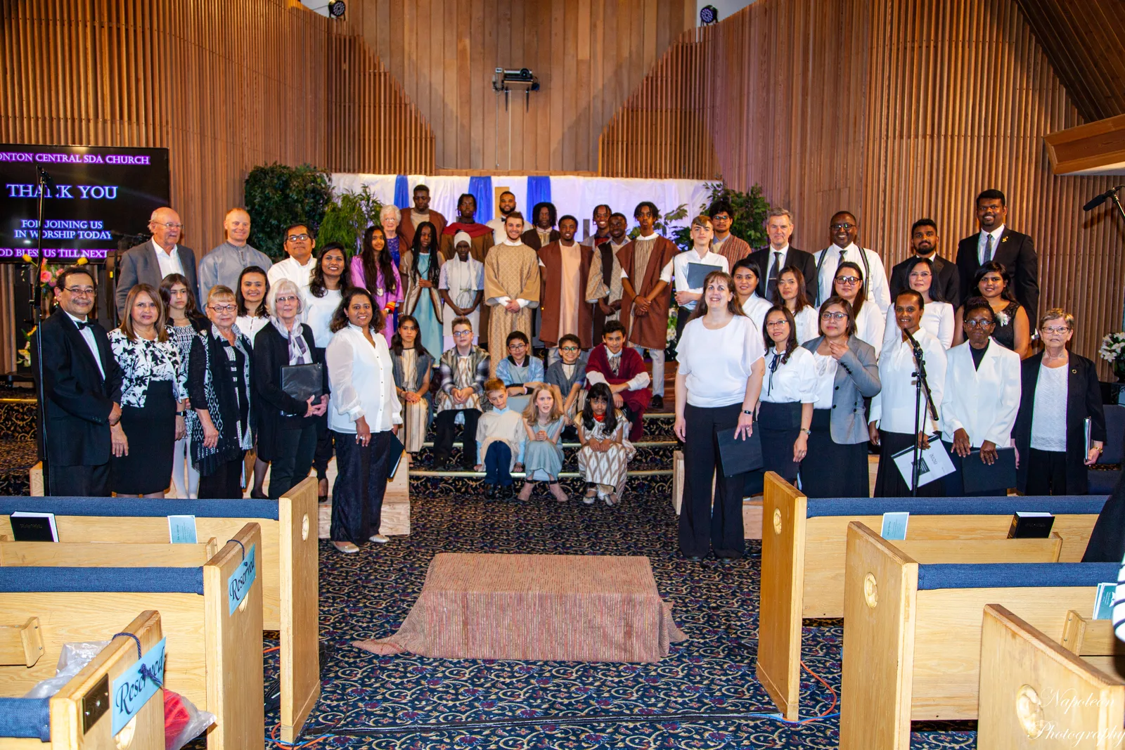 The Edmonton Central choir standing with the cast of the Easter programme in the sanctuary