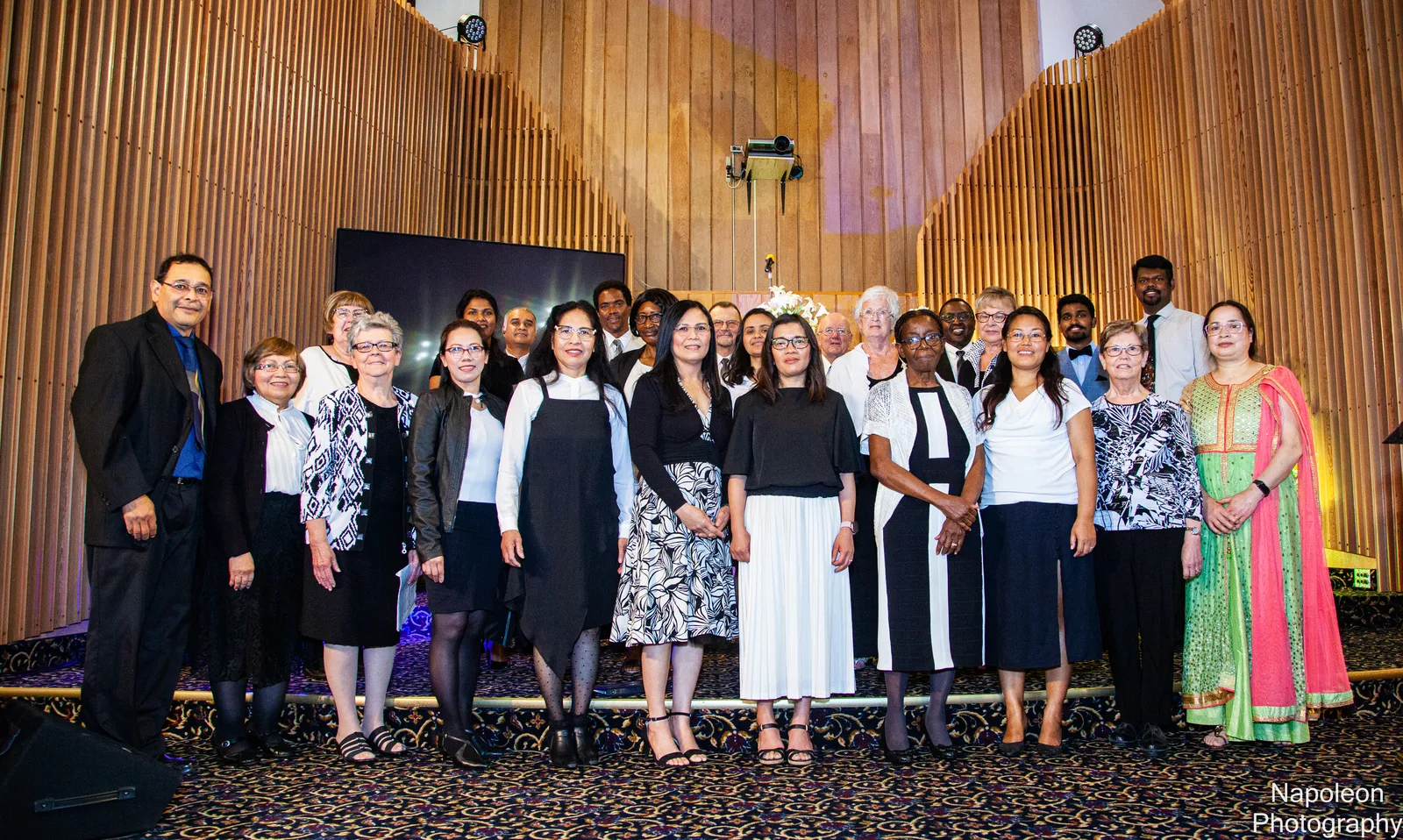 The Edmonton Central choir standing together in the sanctuary after a Sabbath service
